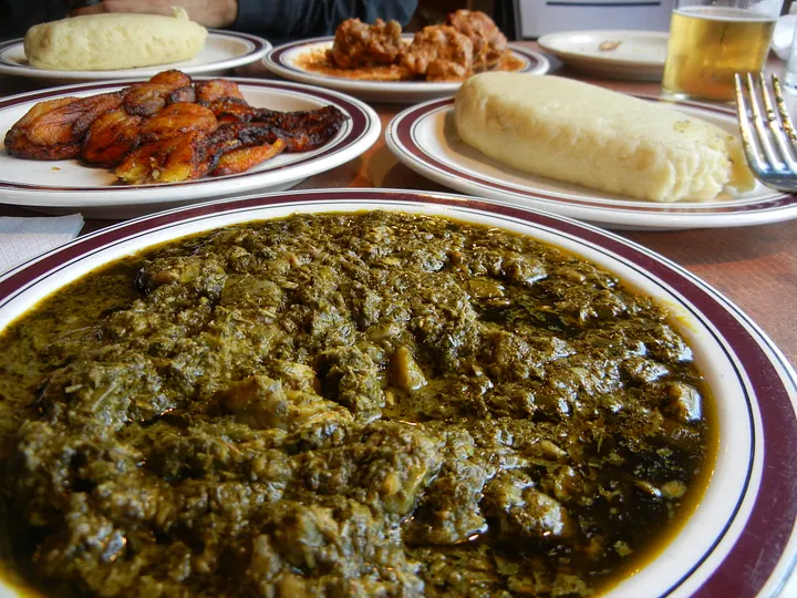 Traditional Congolese meal with saka-saka, plantain and rice